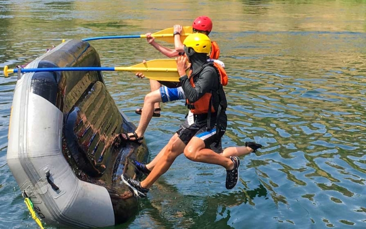 outward bound students participate in a rafting exercise